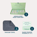 Scent Menu Box, Pedicure Towels, and Salon Window Sticker on a grey background.
