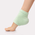 Voesh moisturizing heel sock on a model.