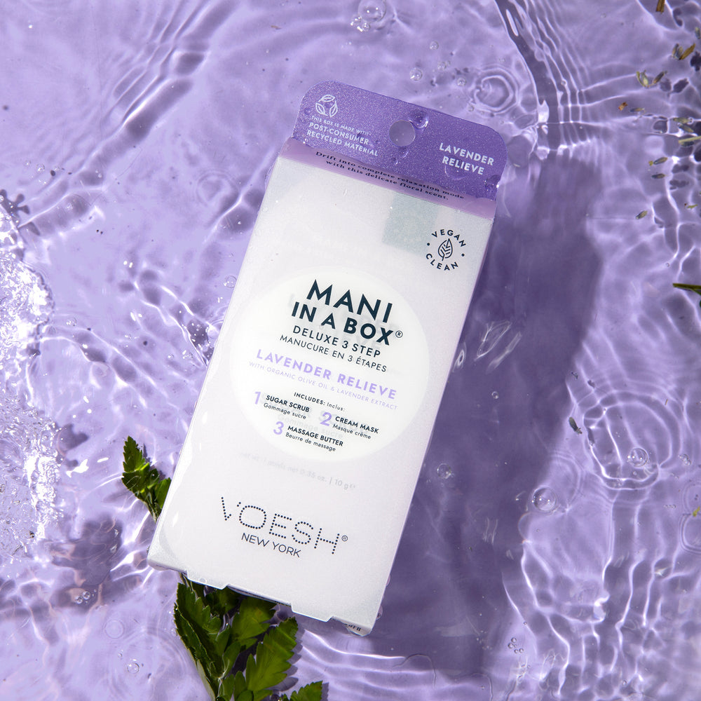 Lavender Relieve Mani in a Box on purple background with water