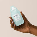 hand holding Callus Remover Gel satchet