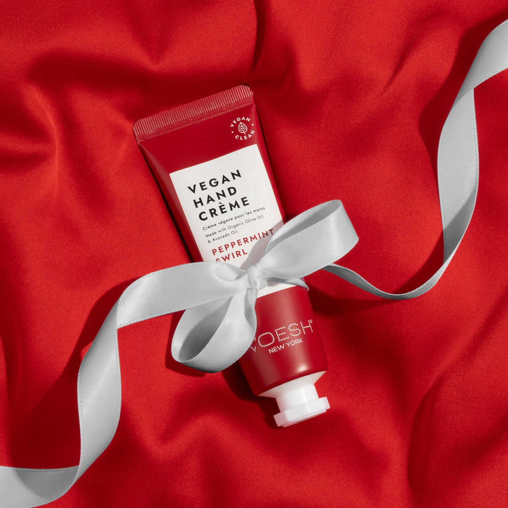 Peppermint Swirl lotion on top of red fabric with white bow