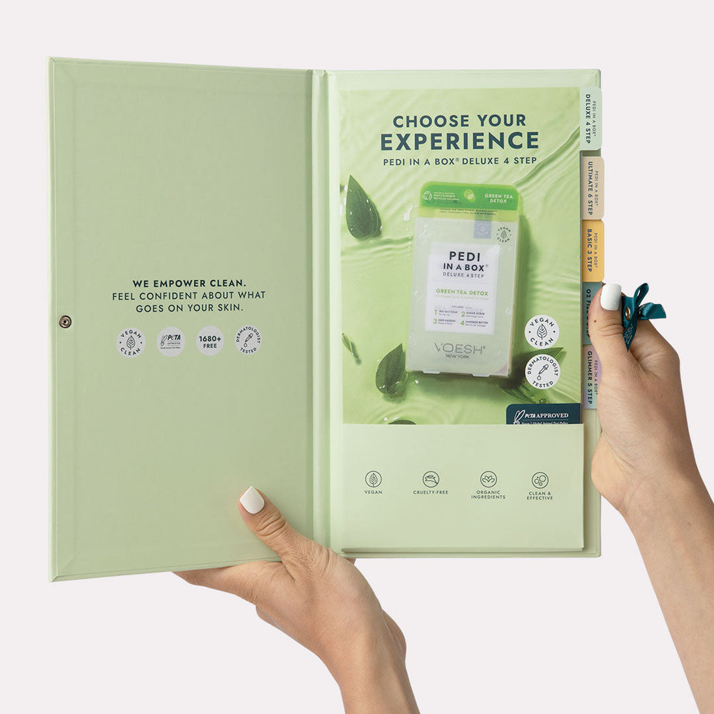 Salon Menu Holder opened up with menus showing and woman's hand holding it