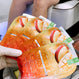 Woman holding Pedi 4 step Mango satchet at Lotus Nail Spa