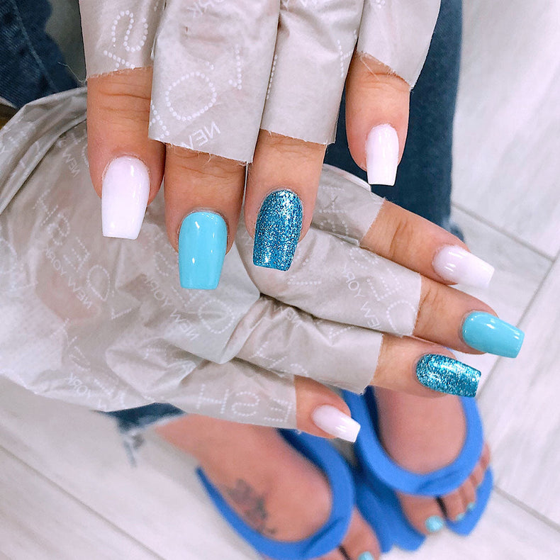 Woman wearing collagen gloves at Lotus Nail Spa