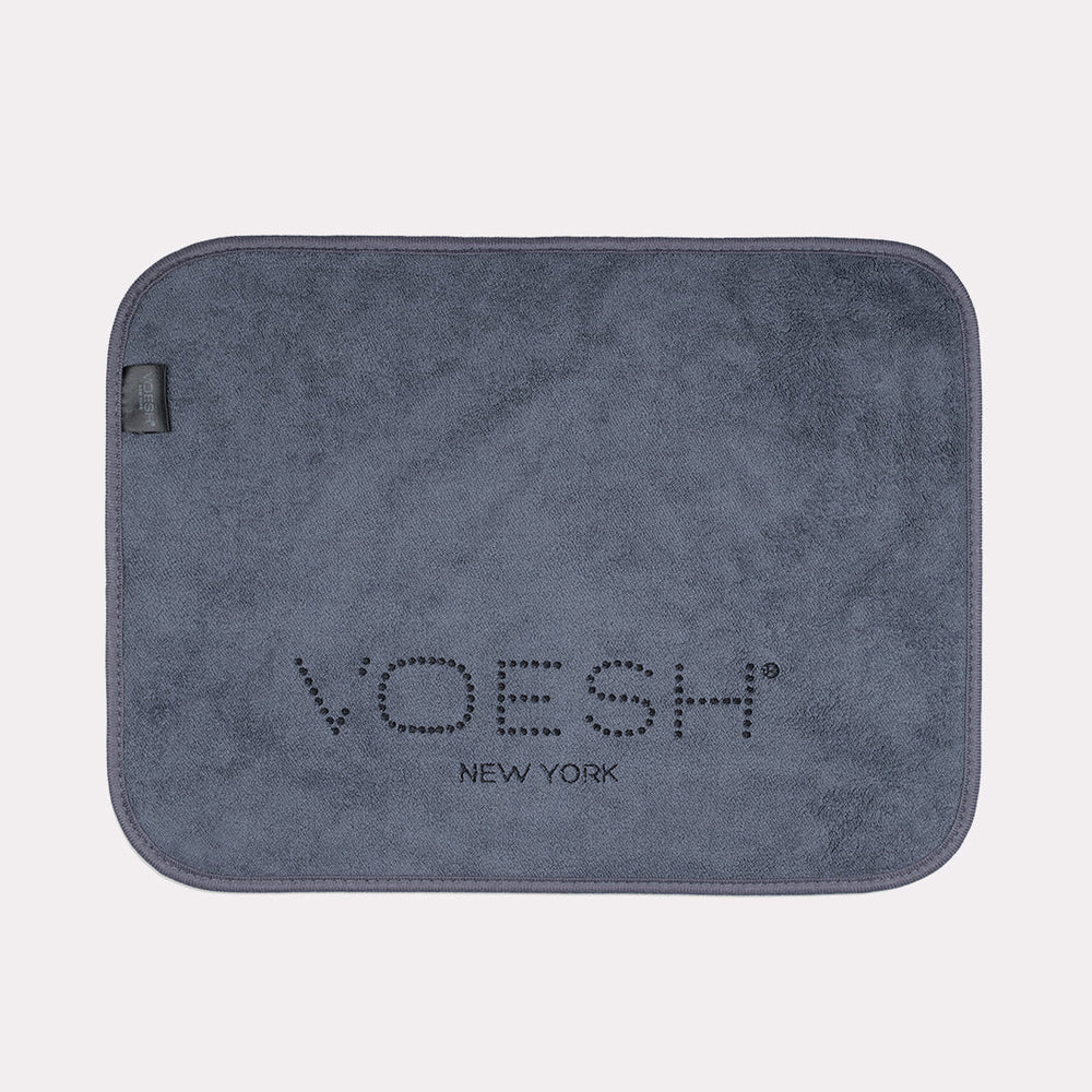 Grey Voesh microfiber pedi towel on gray background