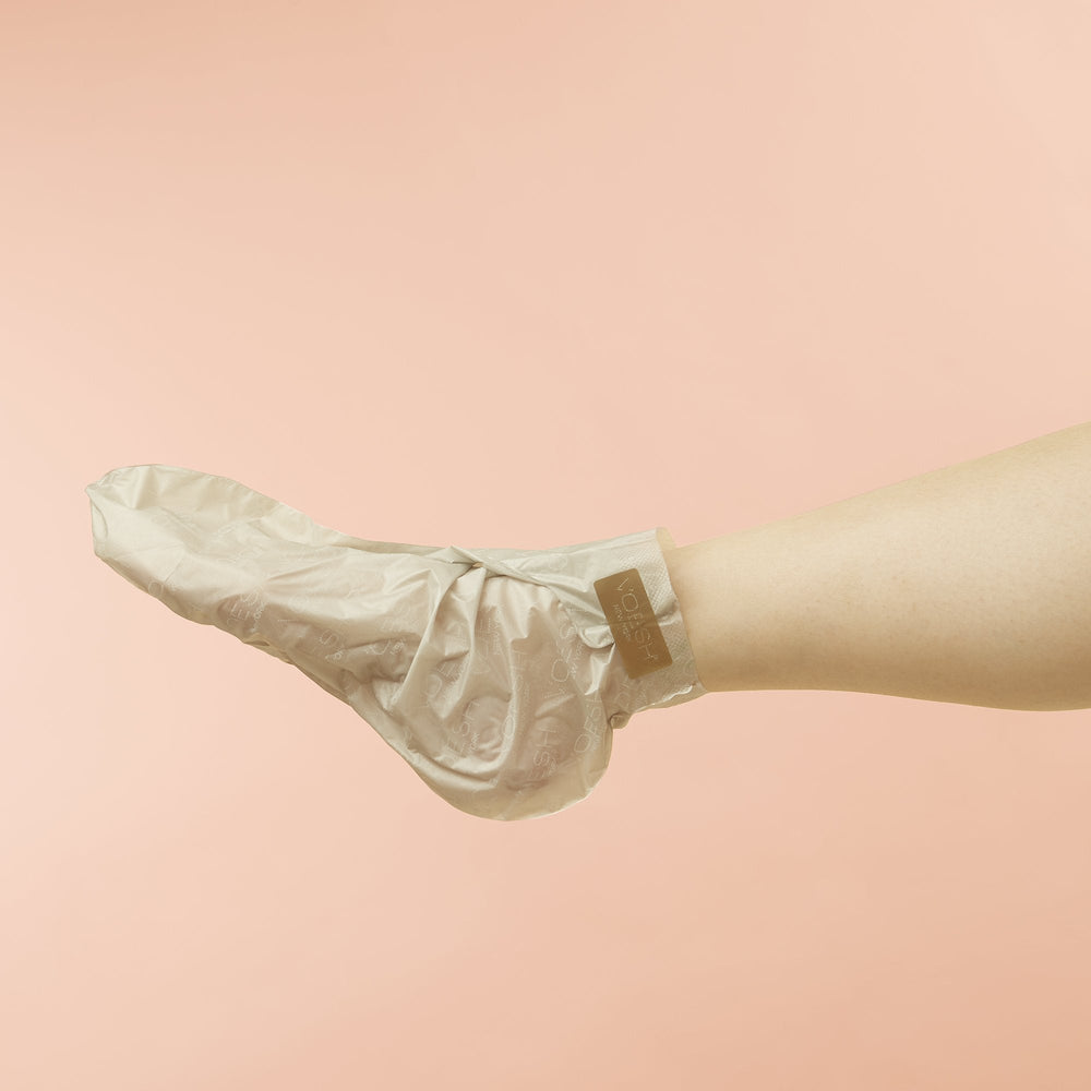 Woman wearing Collagen Socks on pink background