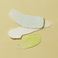 texture of scrub, mud masque, massage lotion on yellow background