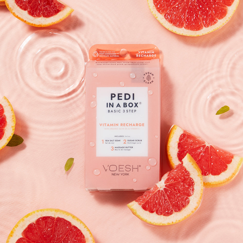 pedi in a box 3 step in water on light pink background with grapefruit slices
