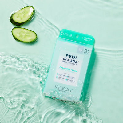 Pedi in a box 4 step cucumber fresh in water on light blue background with cucumbers