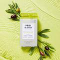 olive sensation pedi n a box 4 step on green background in water with olives and leaves