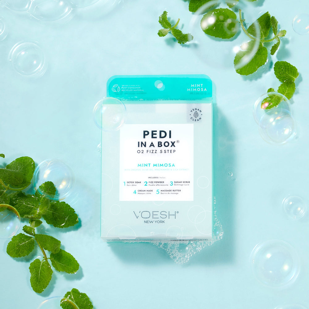 Mint Mimosa Pedi In a Box O2 Fizz 5 Step Box on blue background in water with bubbles and mint leaves