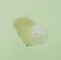 Texture of sugar scrub with bubble on green background