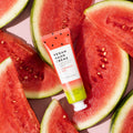 Watermelon Burst lotion against a background watermelon slices