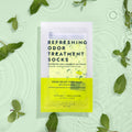 Refreshing Odor Socks with mint leaves in the background