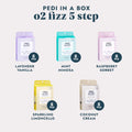 Pedi in a Box O2 Fizz 5 Step Lavender Vanilla, Pedi in a Box O2 Fizz 5 Step Mint Mimosa, Pedi in a Box O2 Fizz 5 Step Sparkling Limoncello, and Pedi in a Box O2 Fizz 5 Step Coconut Cream on a grey background.