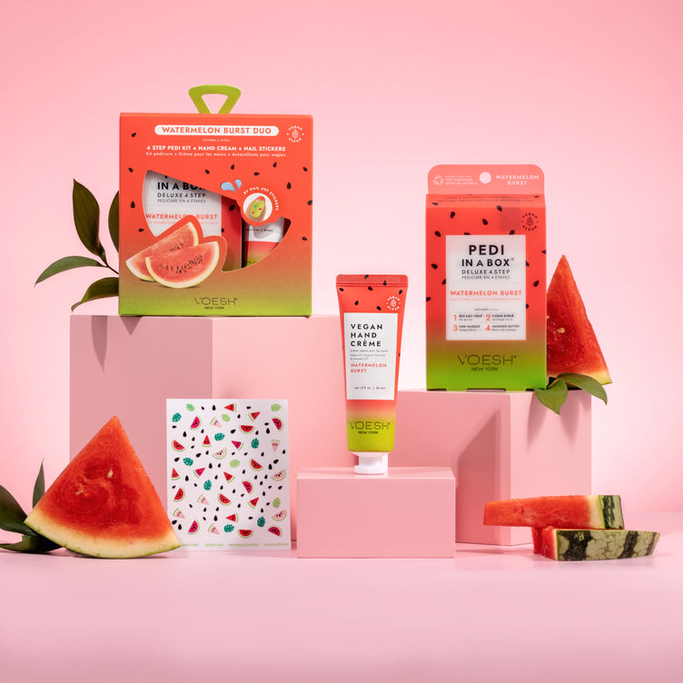 Watermelon Burst Duo, which includes our Pedi in a Box Deluxe 4 Step, Vegan Hand & Body Crème and fun nail art stickers on pink background